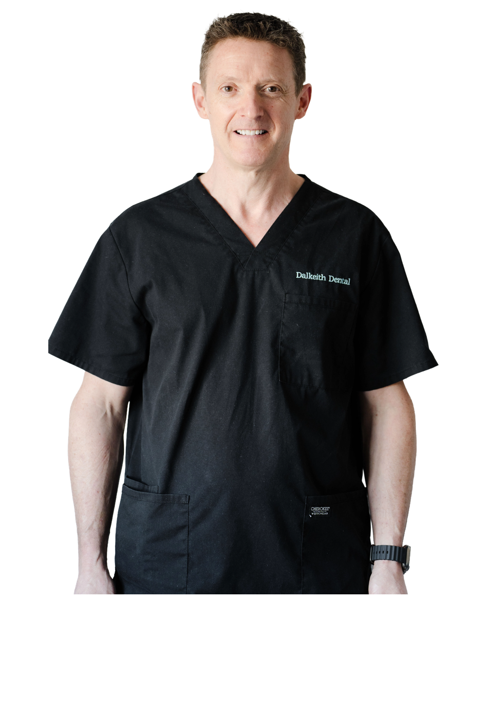 Dr Jeremy Gray smiling in a white dental coat